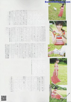 A woman in a red and white dress posing for a picture.
