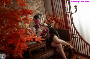 A woman sitting on top of a wooden table.