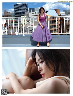 A woman in a black tank top looking out a window.
