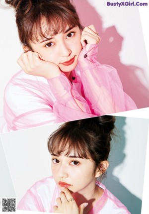 A woman sitting at a table eating spaghetti with a fork.